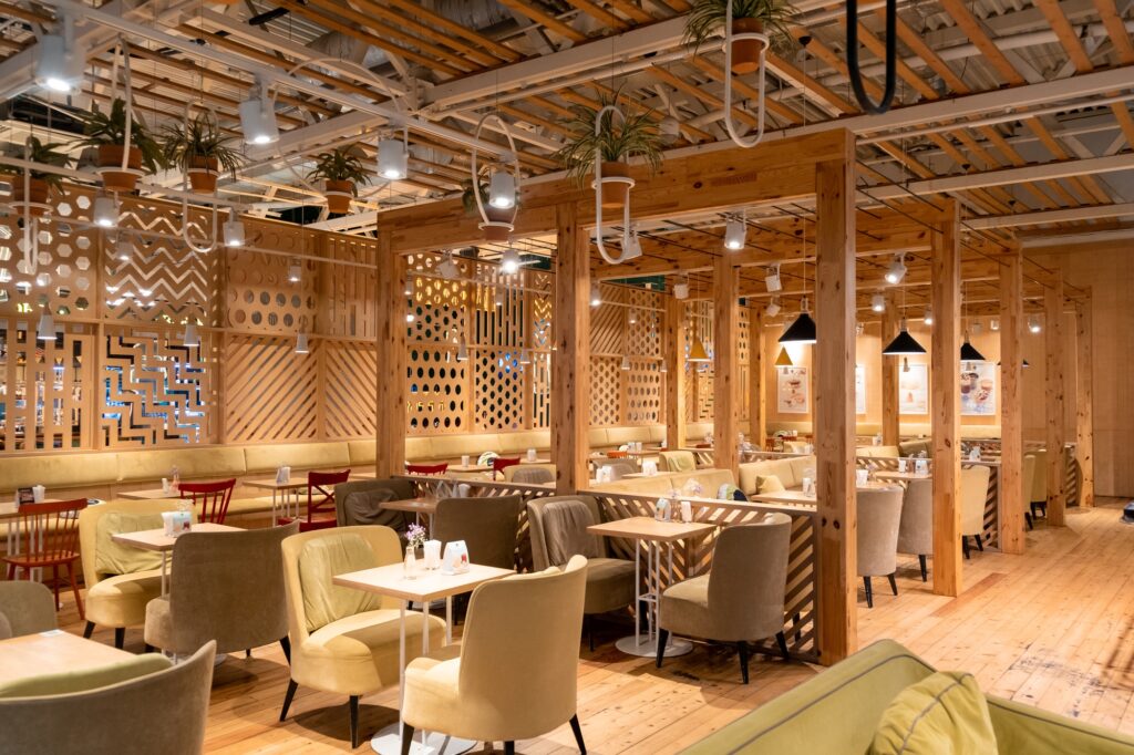 Loft style restaurant with textured wooden walls. Cafe in wooden style